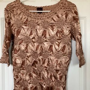 Tan/brown flower patterns pressed top. Size S